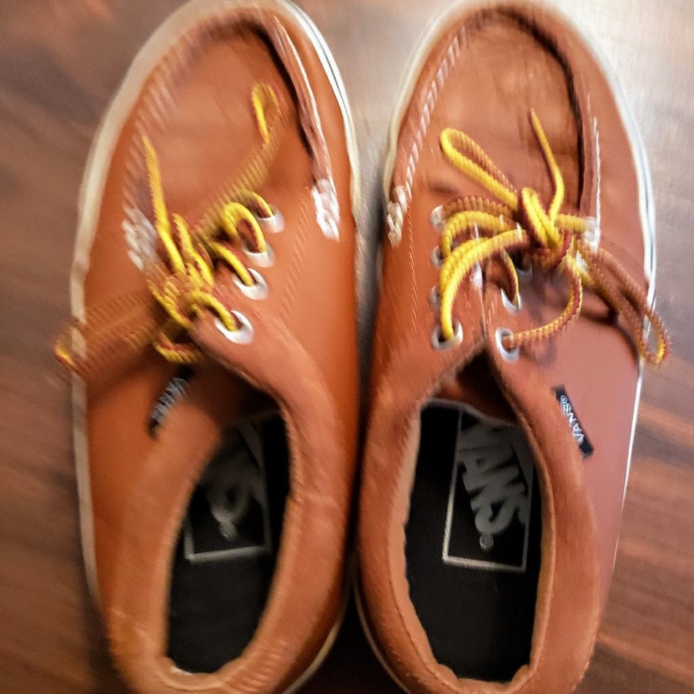 A pair of lovely made of leather  Vans with laces